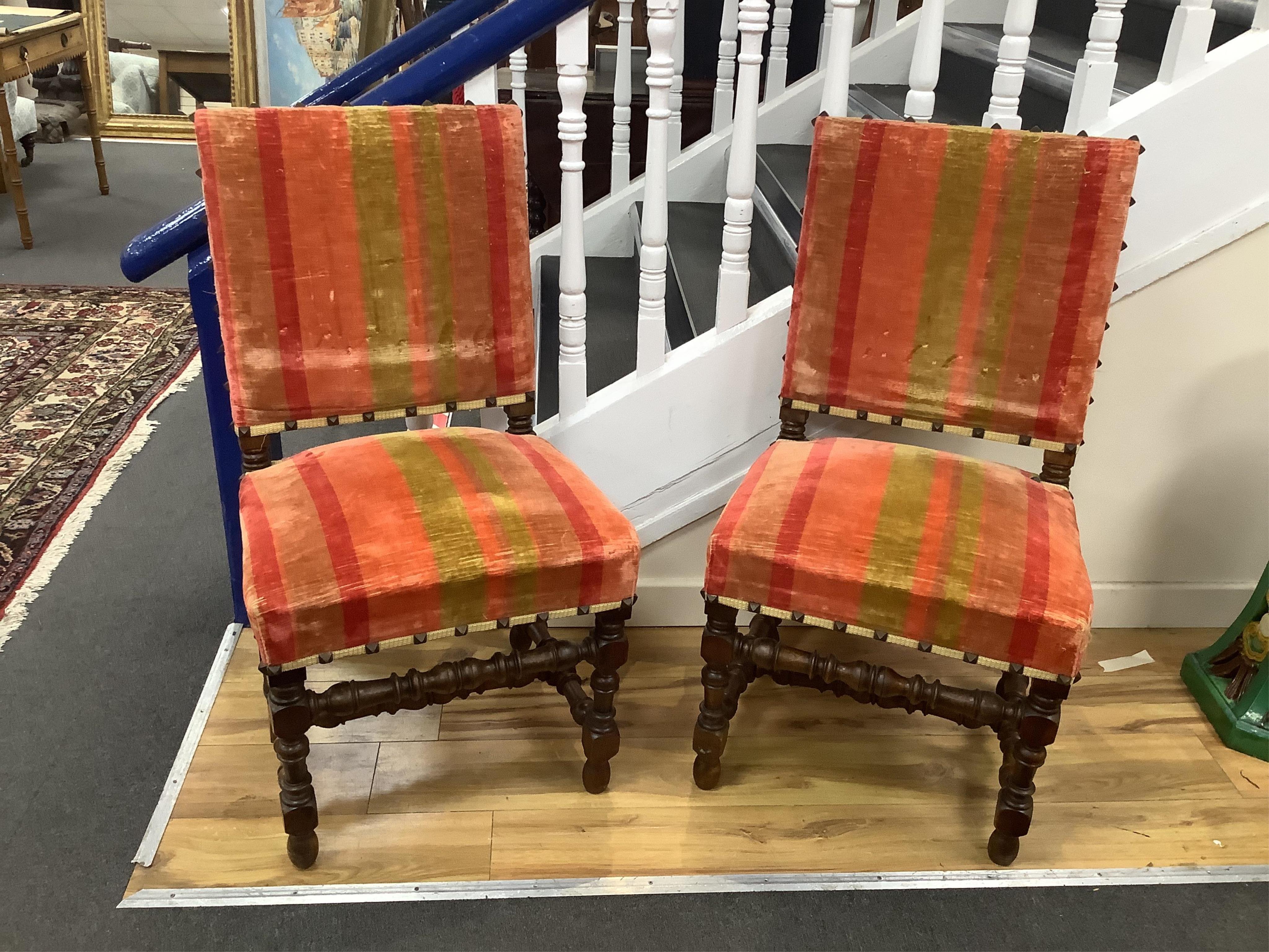 A pair of French walnut elbow chairs, with two matching side chairs, largest 65 x 55cm, height 110cm. Condition - fair